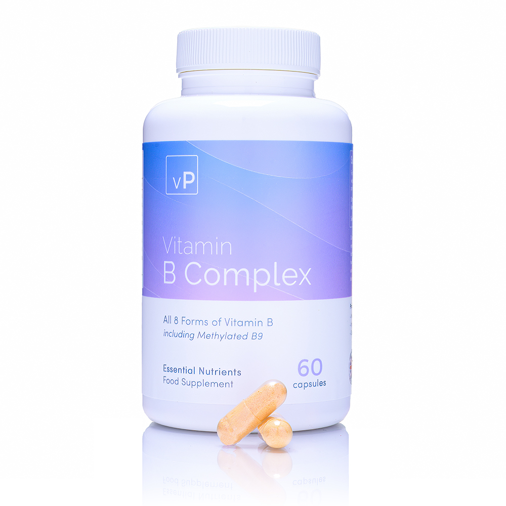 A white supplement bottle with a blue-to-purple gradient label stands on a reflective white surface, with two pale yellow capsules resting in front of it.